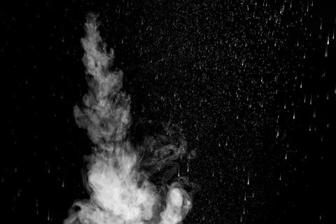 A jet of hot steam with splashes. The movement of hot steam with water drop.. Stock Photos