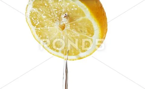Jet juice iflowing from lemon isolated on white Stock Photos