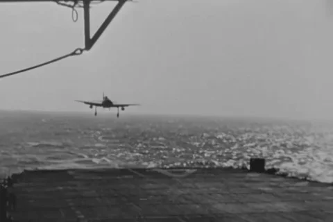 Jet land on flight deck, Towing tractor tow jet during flight operation - 1951 Stock Footage 102874558