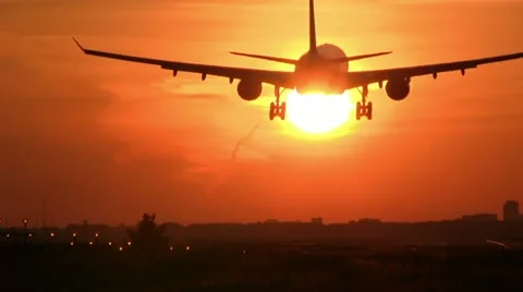 Jet landing at sunset Stock Footage