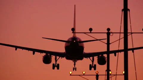 Jet Landing At Sunset Vídeo Stock 65430663