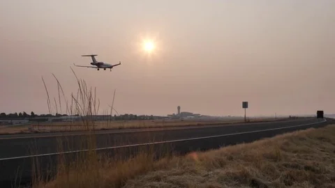 Jet Lands at PDX during Smokey Sunset | Stock Video | Pond5