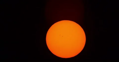 Jet passing in front of sun and Silhouette of wind sock Stock Footage 67337621