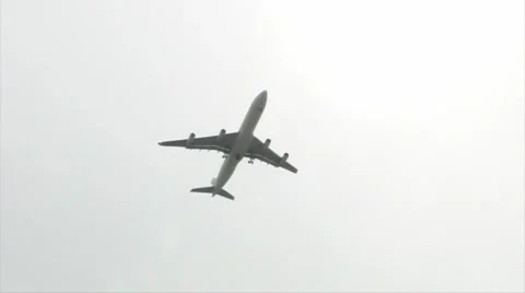 Jet Plane - Air Liner under sun directly above overcast sky plus audio Stock Footage 7752808