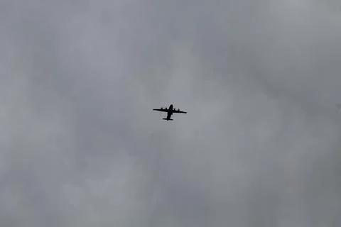Jet plane on background of cloudy sky Stock Photos