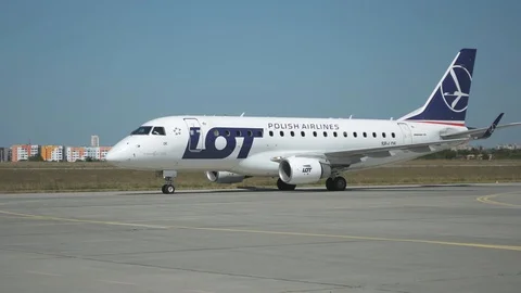 Jet plane E-175 of LOT company taxi on the runway. Stock Footage 94005132
