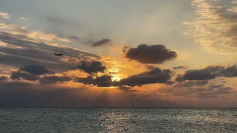 Jet plane flying during a sunset Stock Footage 231119363