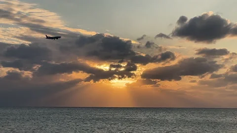 Jet plane flying during a sunset Stock Footage 231119415