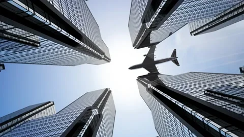 Jet plane flying over skyscrapers in business district - bottom view. Stock Footage