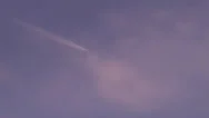 Jet Plane Flying In The Purple Sunset Sky Stock Footage