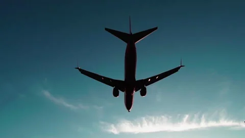Jet plane landing in silhouette. Tracking shot Stock Footage 240909885