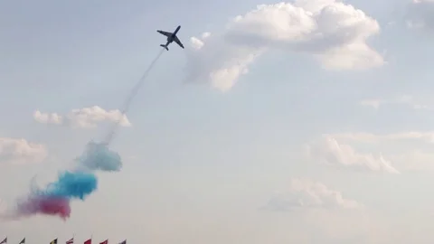A jet plane makes a "Barrel Snap Aileron Roll" figure at an air show. The plane Stock Footage 125286087