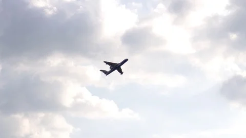 A jet plane makes a "Barrel Snap Aileron Roll" figure at an air show. The plane Stock Footage 125286158