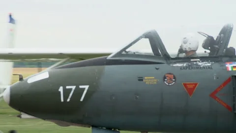 A jet plane rolls on the runway of a small city airport. Stock Footage 134580152