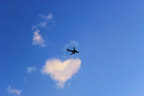 Jet plane in the sky with Condensation trace The only plane in the blue sky Stock Photos