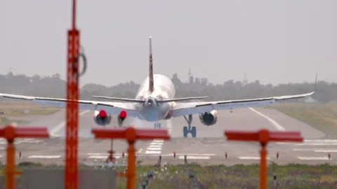 Jet plane slowing down after landing Stock Footage 318940590