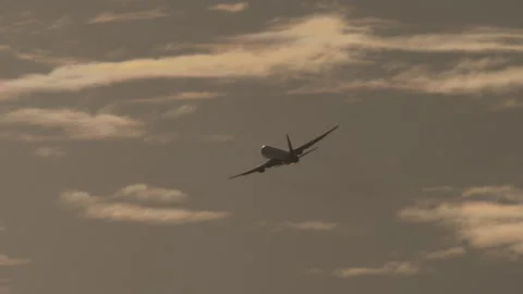 Jet plane take off in cloudy sky Stock Footage 329042271