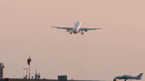 Jet Plane Take Off with Prop Plane in Foreground Stock Footage 27825094
