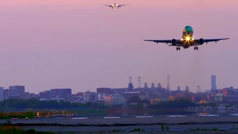 Jet plane taking off in sunset Stock Footage 75698910