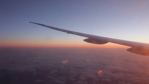 Jet porthole view. Sunset. Clouds 20160127143656 679 2 Stock Footage 129208853