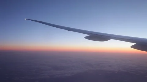 Jet porthole view. Sunset. Clouds 20160127143622 678 2 Video stock 129208864