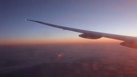 Jet porthole view. Sunset. Clouds 20160127143656 679 1 動画素材 129208869