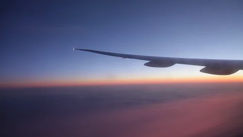 Jet porthole view. Sunset. Clouds 20160127143622 678 1 Video stock 129208870