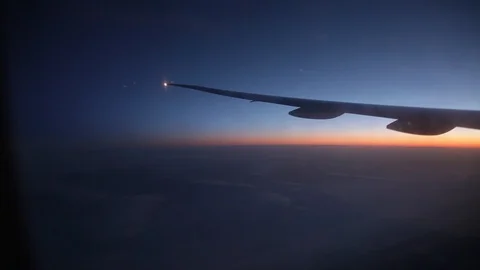 Jet porthole view. Sunset. Clouds 20160127143440 674 2 動画素材 129208884