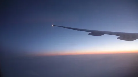 Jet porthole view. Sunset. Clouds 20160127143516 676 1 Stock Footage 129208892