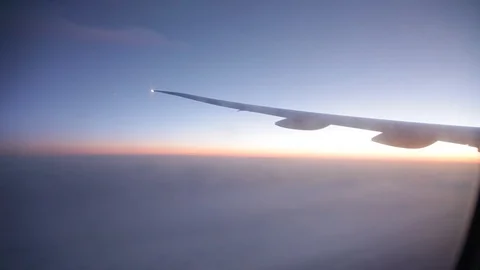 Jet porthole view. Sunset. Clouds 20160127143516 676 2 Stock Footage 129208893