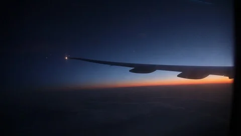 Jet porthole view. Sunset. Clouds 20160127143408 673 2 Stock-Footage 129208901