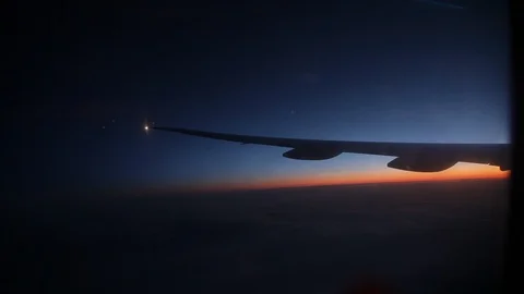 Jet porthole view. Sunset. Clouds 20160127143408 673 1 Video stock 129208924