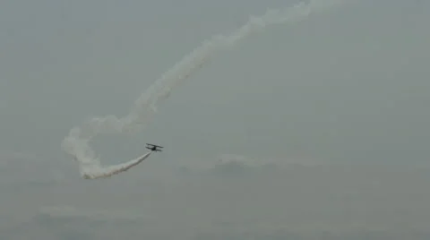 Jet-powered biplane performing aerobatics 24P 4K Stock Footage 42697009