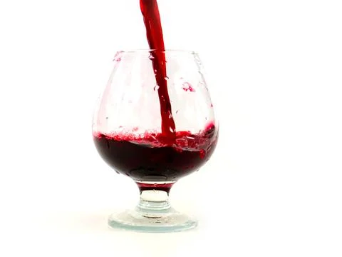 A jet of red wine Stock Photos