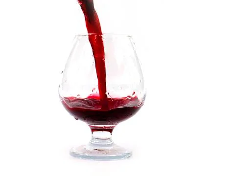 A jet of red wine Stock Photos