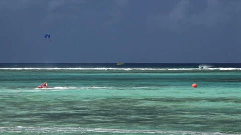 Jet Ski and Parasailing Stock-Footage 324925408