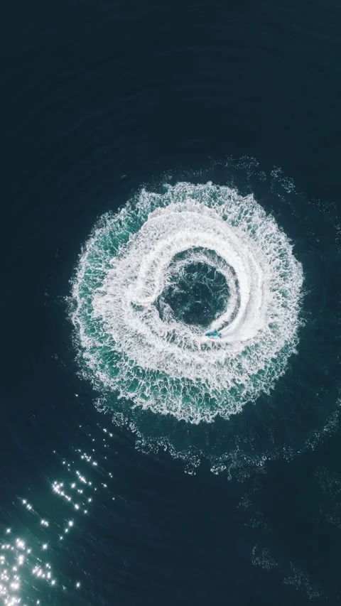 Jet Ski Creates Dynamic Spiral Patterns in Ocean Waters Stock Footage 275305110
