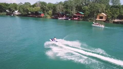 Jet ski cruising a river Stock Footage 166374797