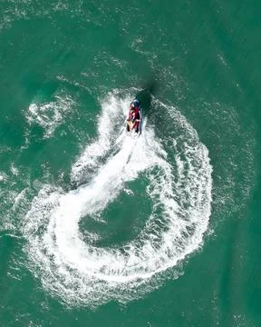 Jet ski doing u turn during a summer day at the lake Stock Photos