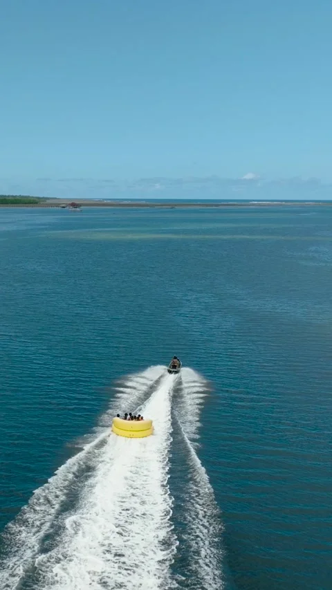 Jet ski dragging a watercraft in tropical ocean surface. Philippines. Stock Footage 253256967