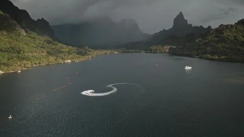 Jet ski drawing an s shape in Opunohu bay, Moorea, French Polynesia Stock Photos