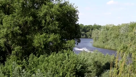 A jet ski floats with splashes on the river. Stock Footage 155230479