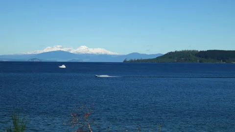 Jet Ski On Lake with Mountain in background Stock Footage 250134294