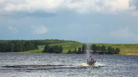 Jet-ski on lake in summer day Stock Footage