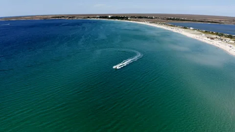 Jet ski leaves behind waves on the sea Video stock 144796801