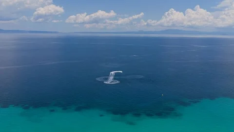Jet Ski Making Circular Patterns in Blue Sea in Greece Stock Footage 340322913