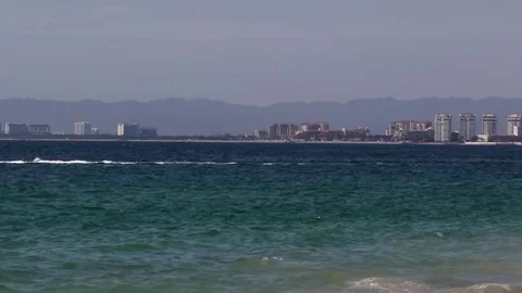 Jet ski in the ocean, city in the background Stock Footage 78009907
