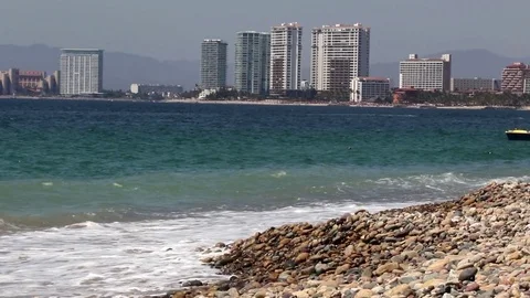 Jet ski in the ocean, crossing frame, city Stock Footage 78111625