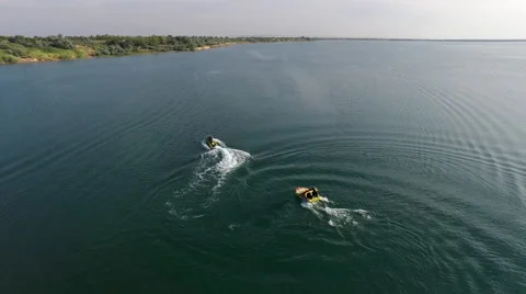 Jet Ski Pulling Inflatable Raft With A Man Stock Footage 59134891