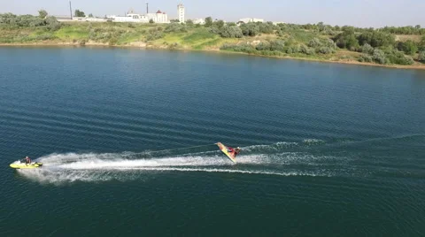 Jet Ski Pulling Inflatable Raft With A Man On Lake Stock Footage 59723086